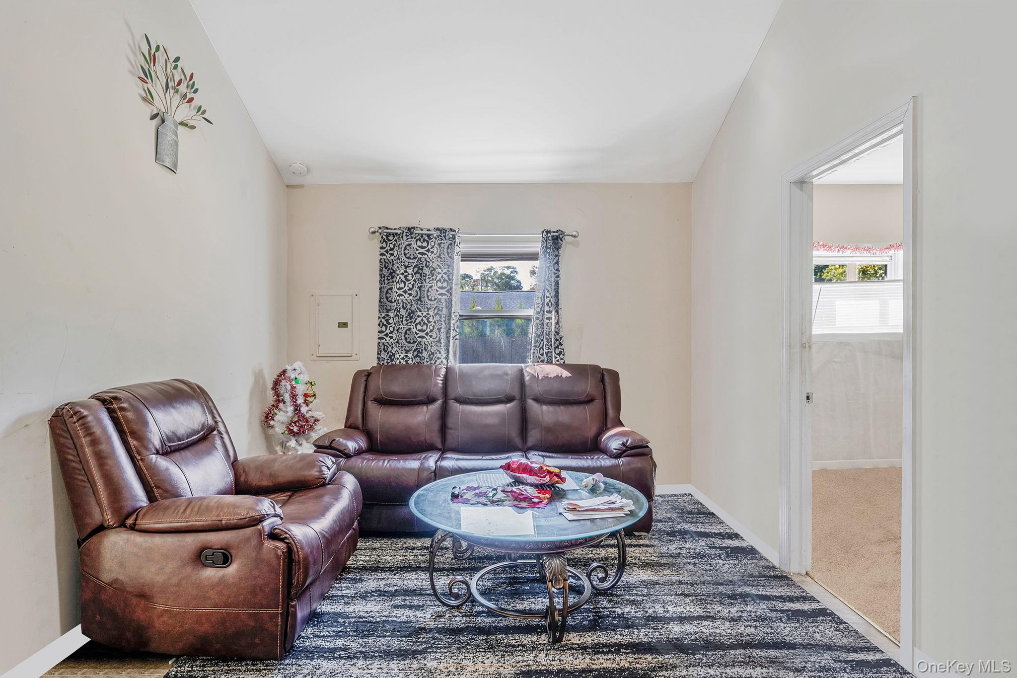 15 Sayville Road Mastic Beach, NY 11951 - Photo 8 of 25 a living room with furniture and a rug