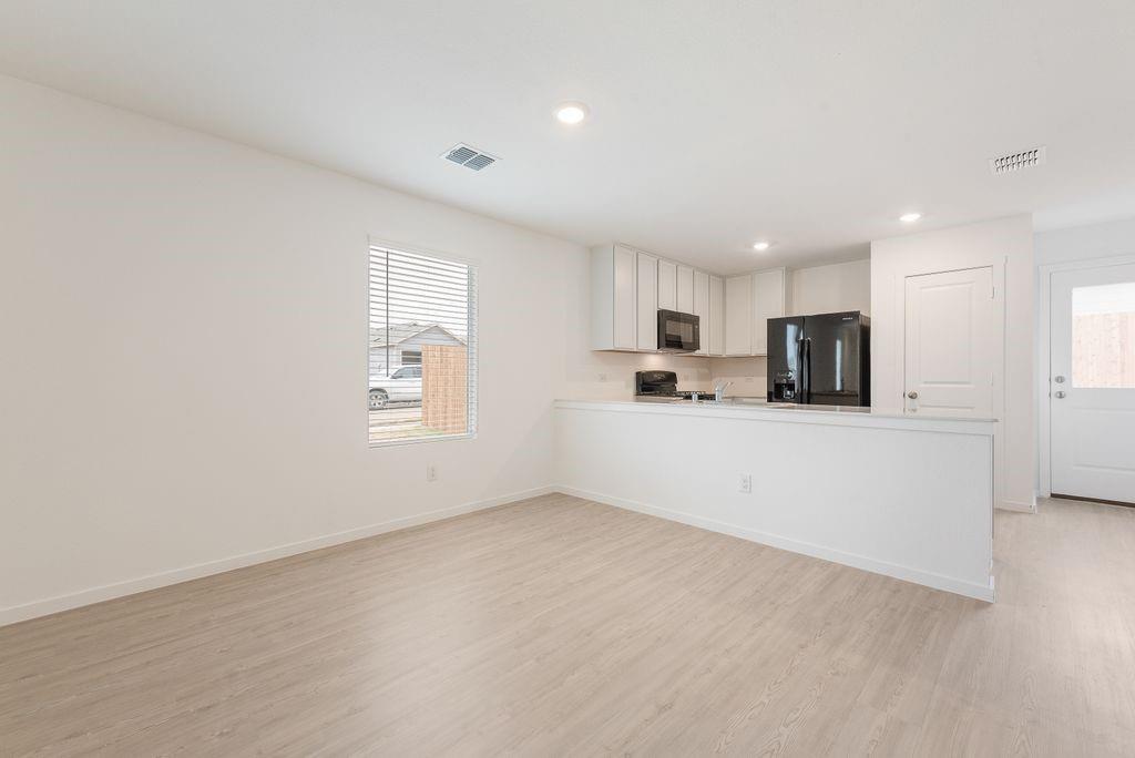 14109 Lampard Street Pilot Point, TX 76258 - Photo 5 of 16 a view of a kitchen with electric equipment