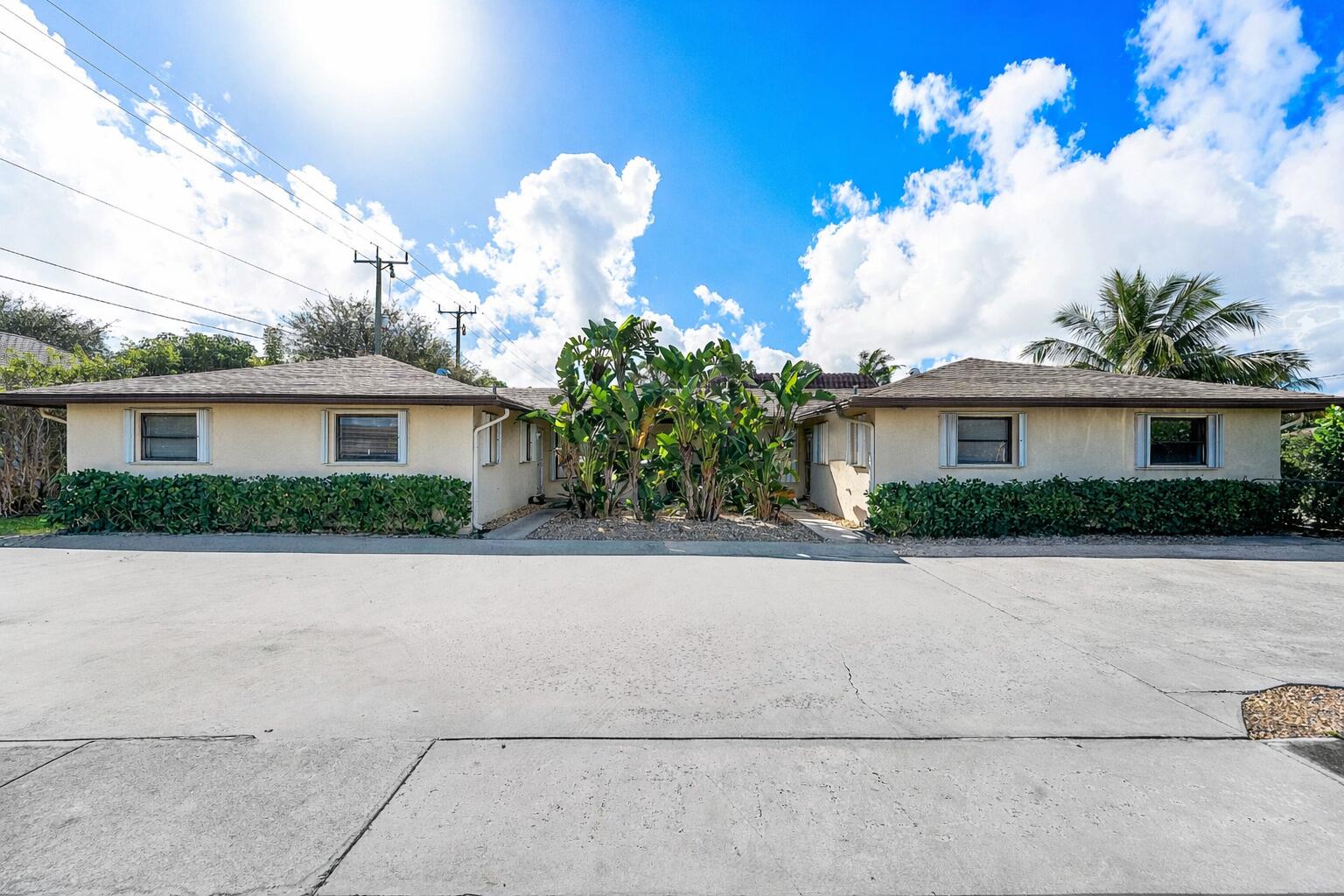 a front view of a house with a yard and a garage