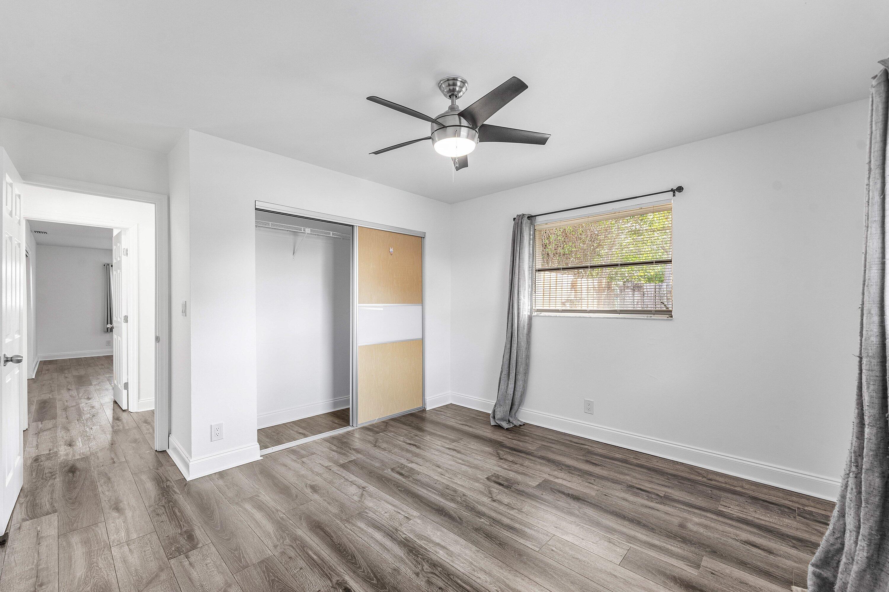 502 Northeast 48th Street Boca Raton, FL 33431 - Photo 23 of 30 a view of empty room with wooden floor