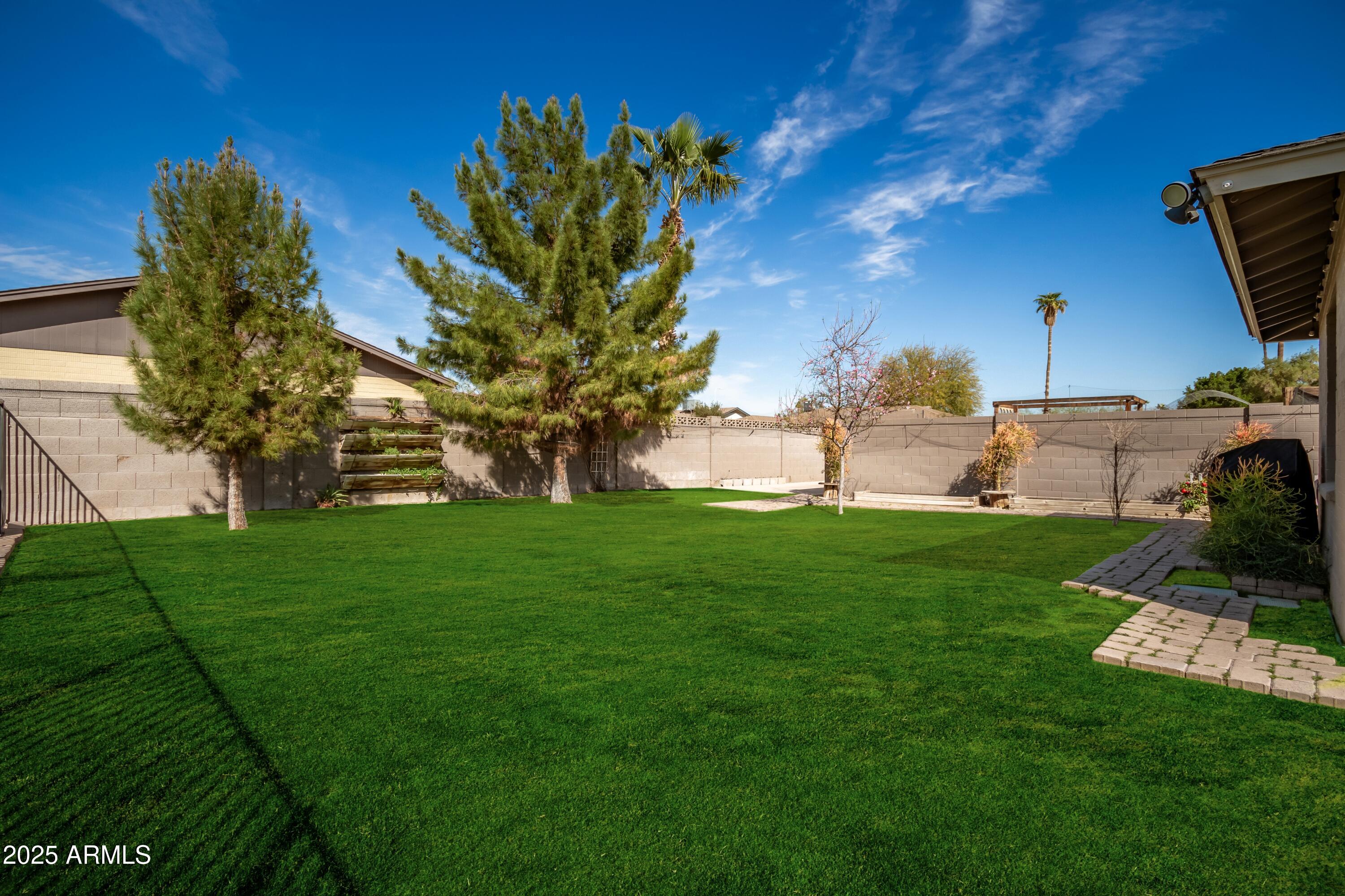 1506 East Gemini Drive Tempe, AZ 85283 - Photo 35 of 42 Lush green yard and trees