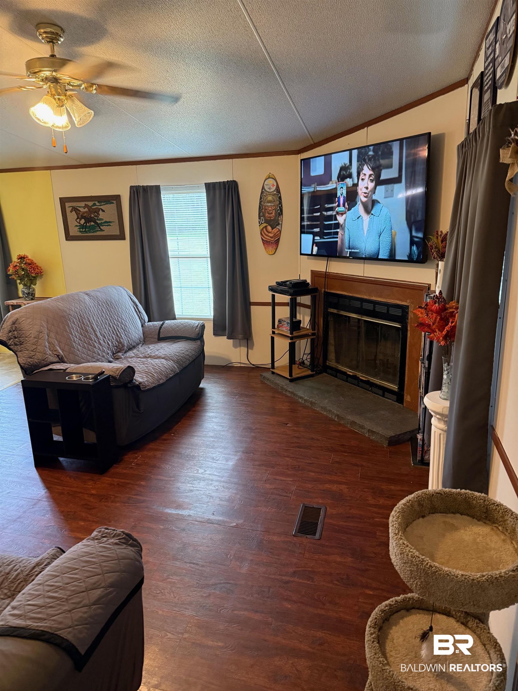 15844 County Road 87 Elberta, AL 36530 - Photo 10 of 28 Living room featuring crown molding, ceiling fan, dark hardwood / wood-style floors, and a textured ceiling
