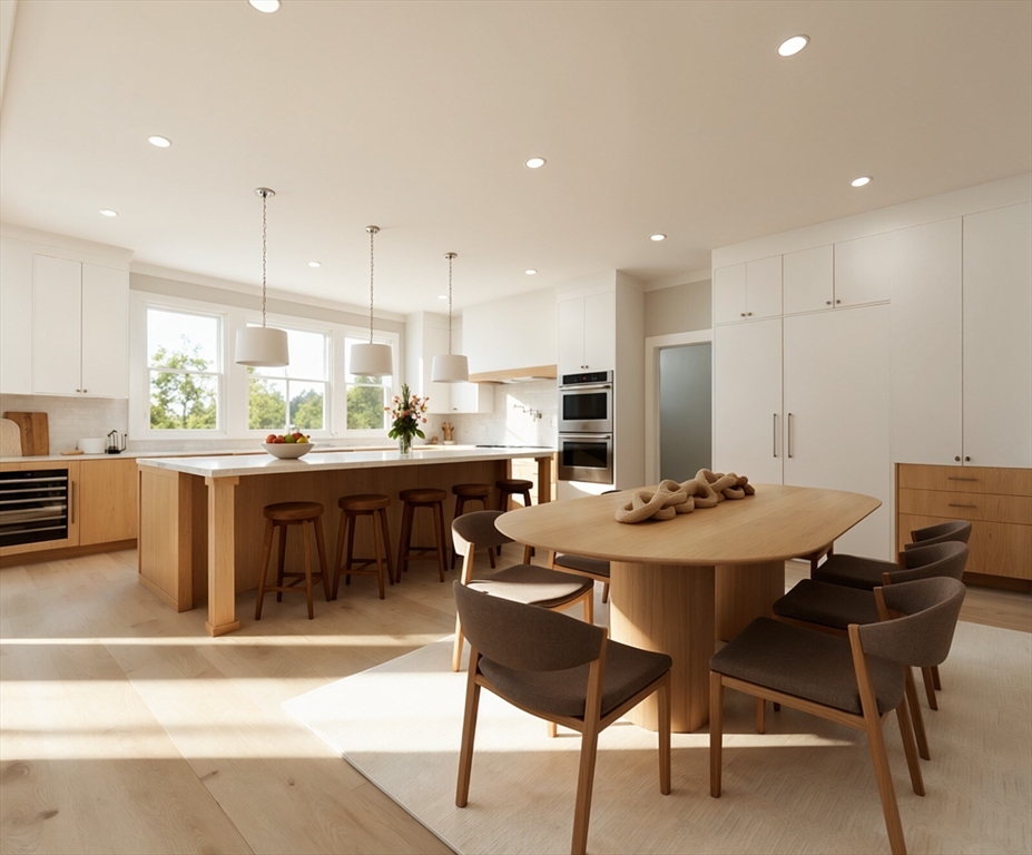 28 Parker Road Wellesley, MA 02482 - Photo 5 of 32 a kitchen with a dining table chairs and white appliances