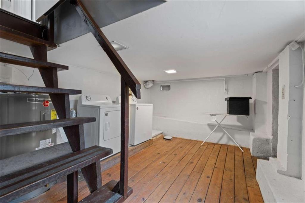 1621 North Columbia Place Decatur, GA 30032 - Photo 18 of 33 a bedroom with a bed and a flat screen tv