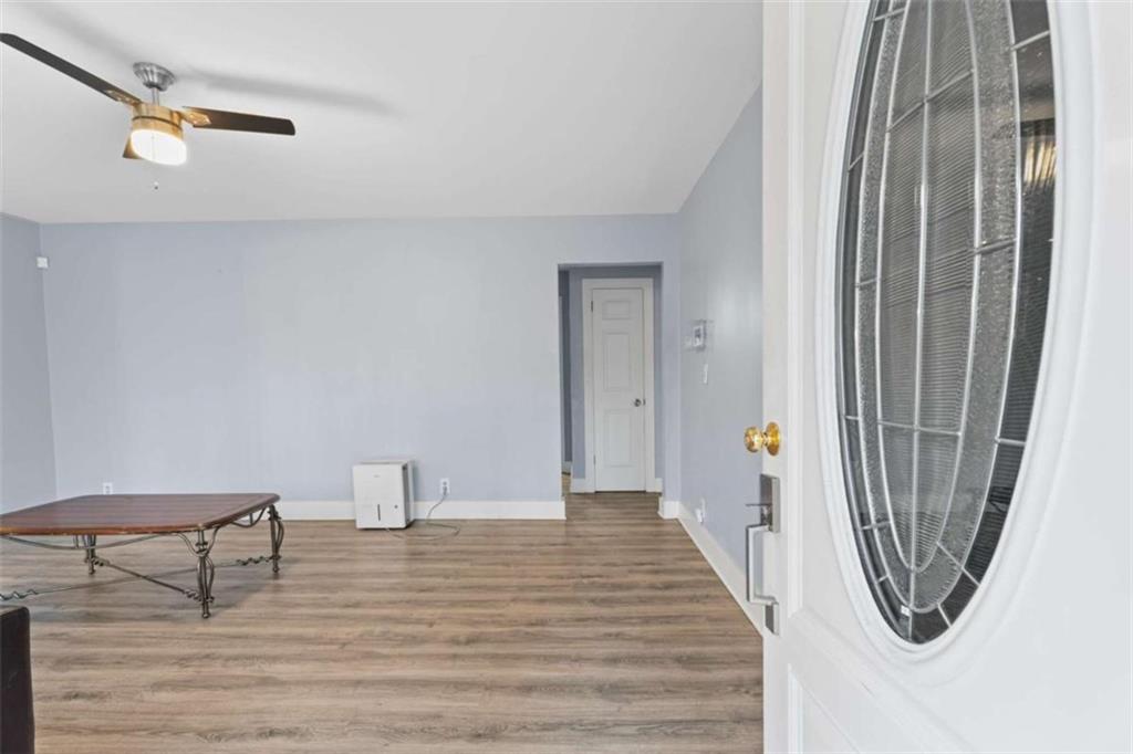 1621 North Columbia Place Decatur, GA 30032 - Photo 5 of 33 a view of a hallway with wooden floor and staircase