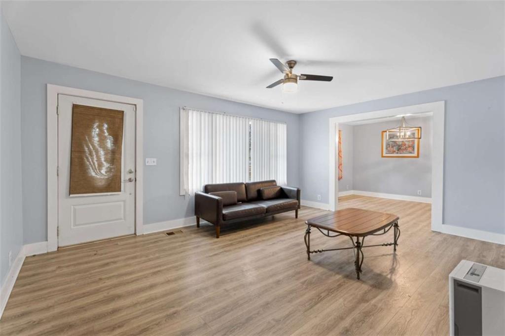 1621 North Columbia Place Decatur, GA 30032 - Photo 7 of 33 a living room with furniture and a wooden floor