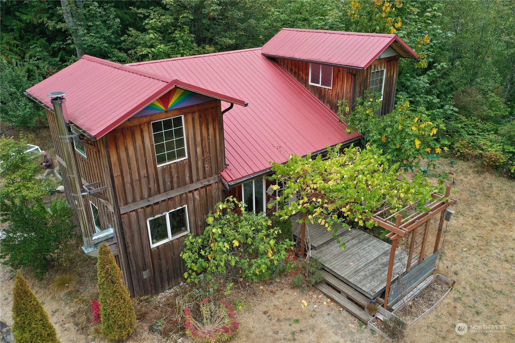 3624 Dabob Road Quilcene, WA 98376 - Photo 1 of 37 a aerial view of a house with a yard and potted plants