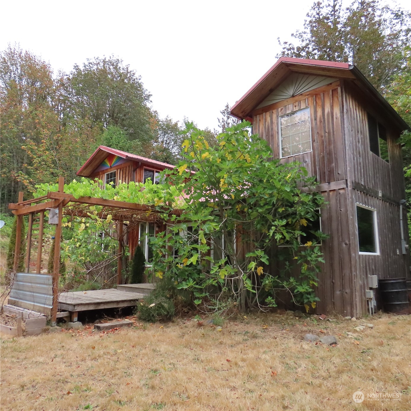 3624 Dabob Road Quilcene, WA 98376 - Photo 23 of 37 a front view of a house with garden
