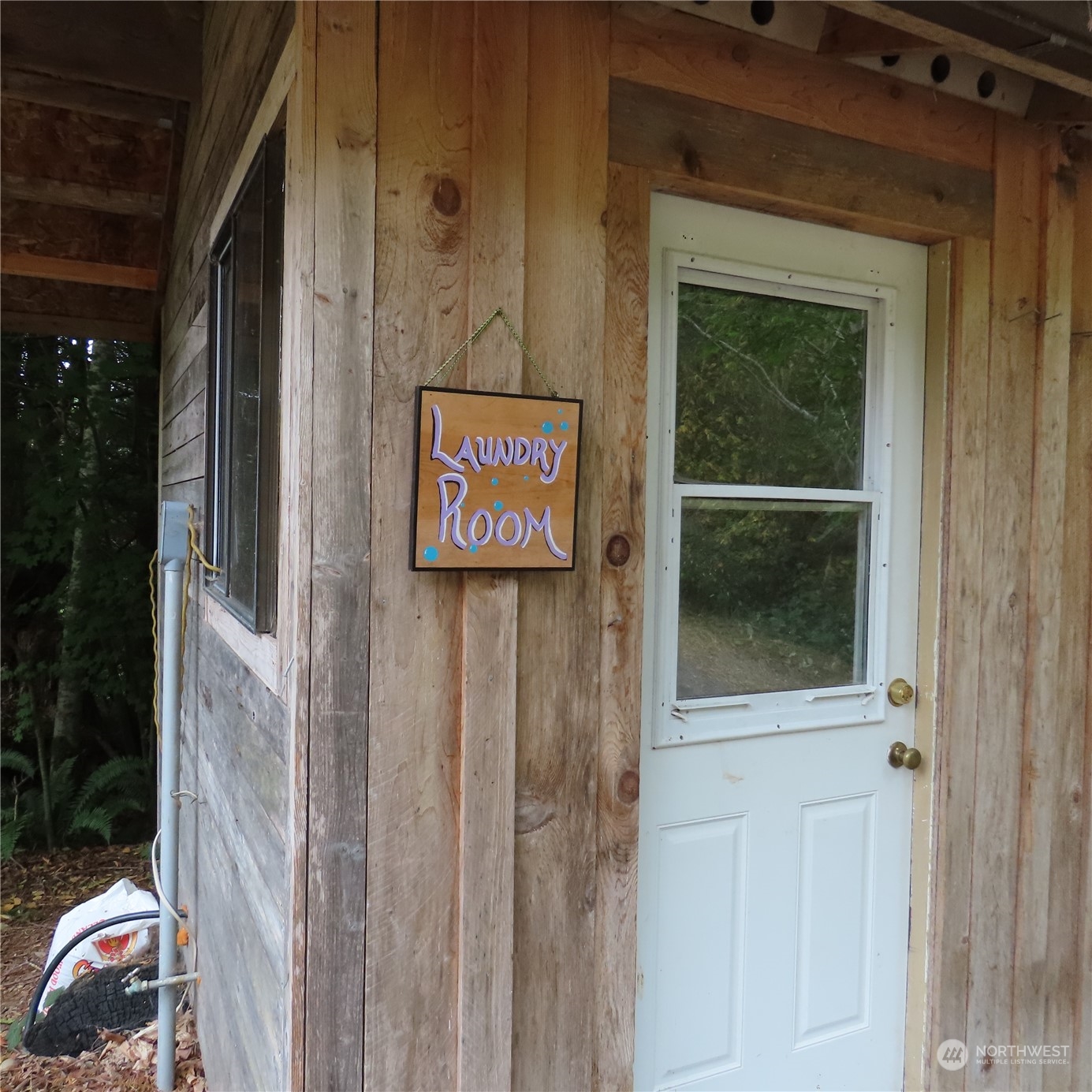 3624 Dabob Road Quilcene, WA 98376 - Photo 24 of 37 a sign that is on the side of a building