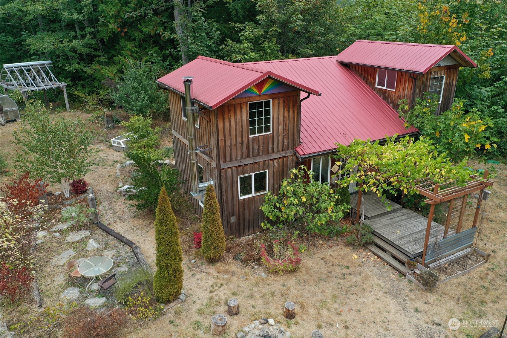 3624 Dabob Road Quilcene, WA 98376 - Photo 6 of 37 a view of a house with a yard and plants