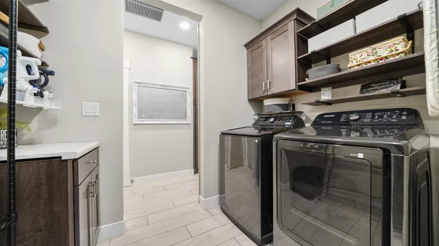 a view of a kitchen with washer and dryer