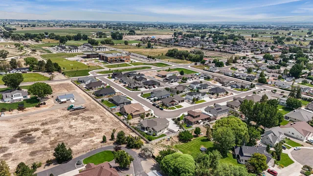 an aerial view of residential houses with outdoor space