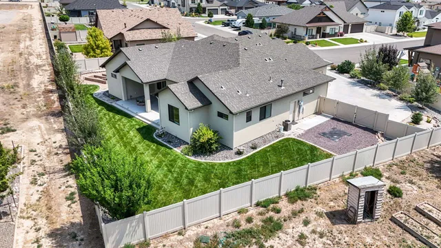 an aerial view of a house with a garden and yard