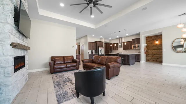 a living room with furniture and a fireplace