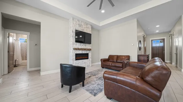 a living room with furniture and a flat screen tv