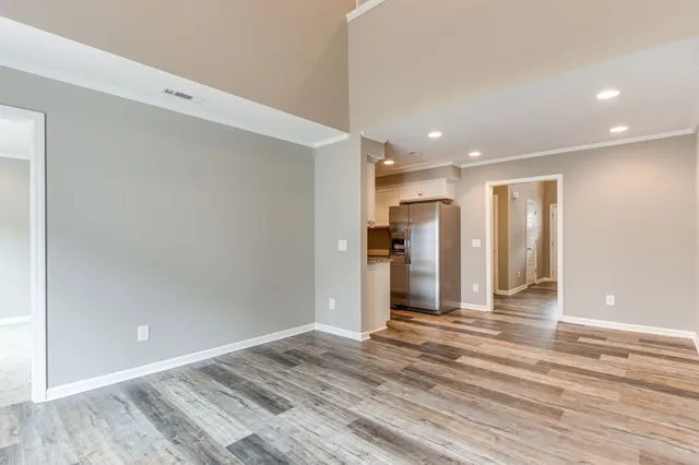 a view of a livingroom with wooden floor