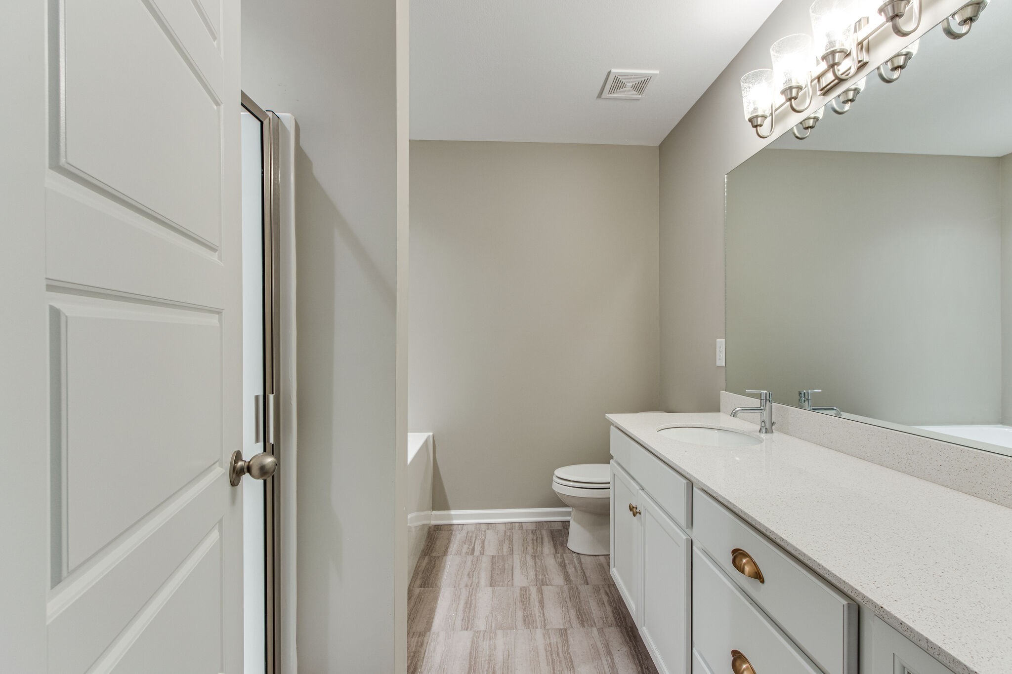 3524 Learning Lane Murfreesboro, TN 37128 - Photo 5 of 14 a view of a bathroom with a sink mirror and toilet