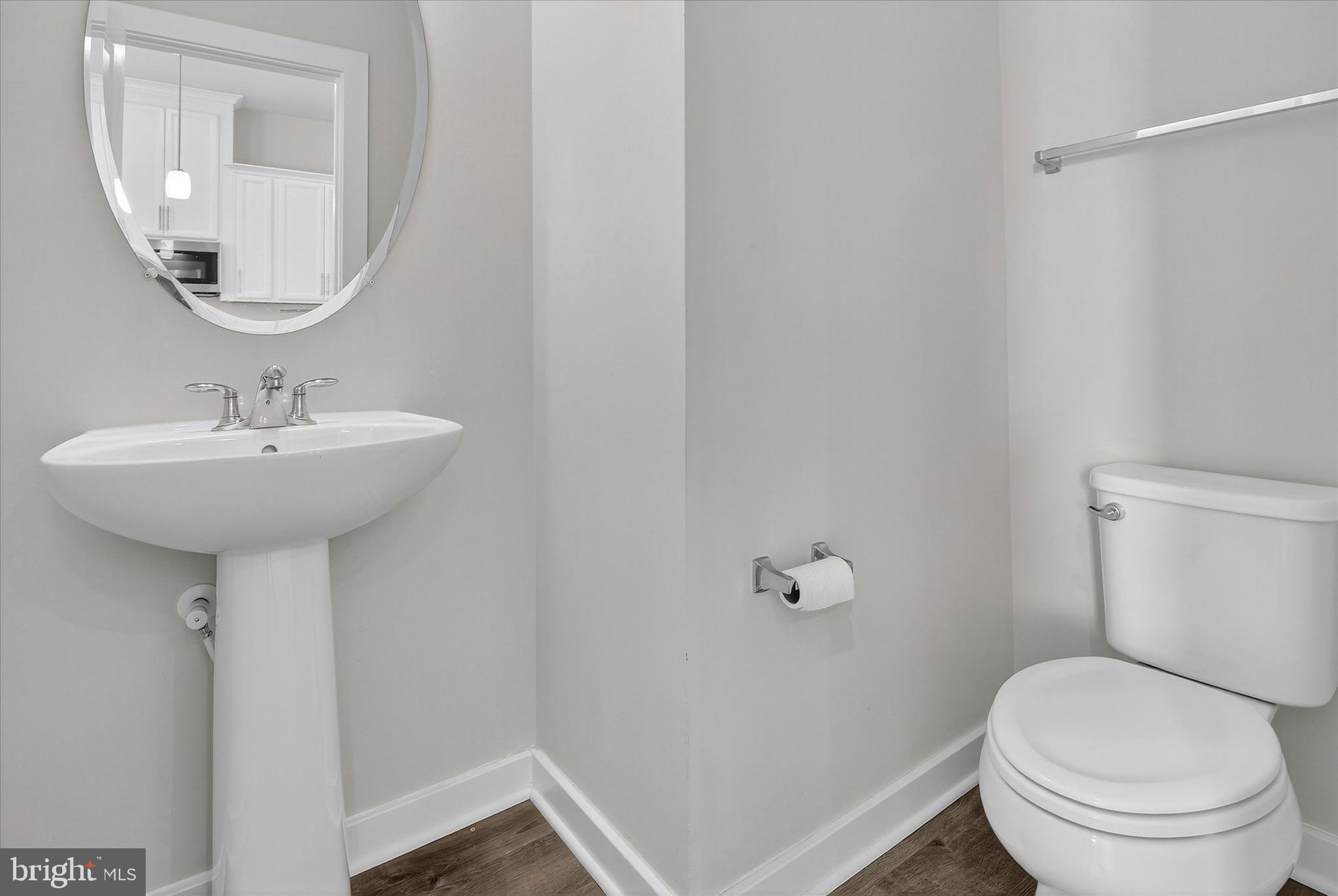 1681 Aspen Poplar Road Dumfries, VA 22026 - Photo 13 of 36 a bathroom with a sink a toilet and a mirror
