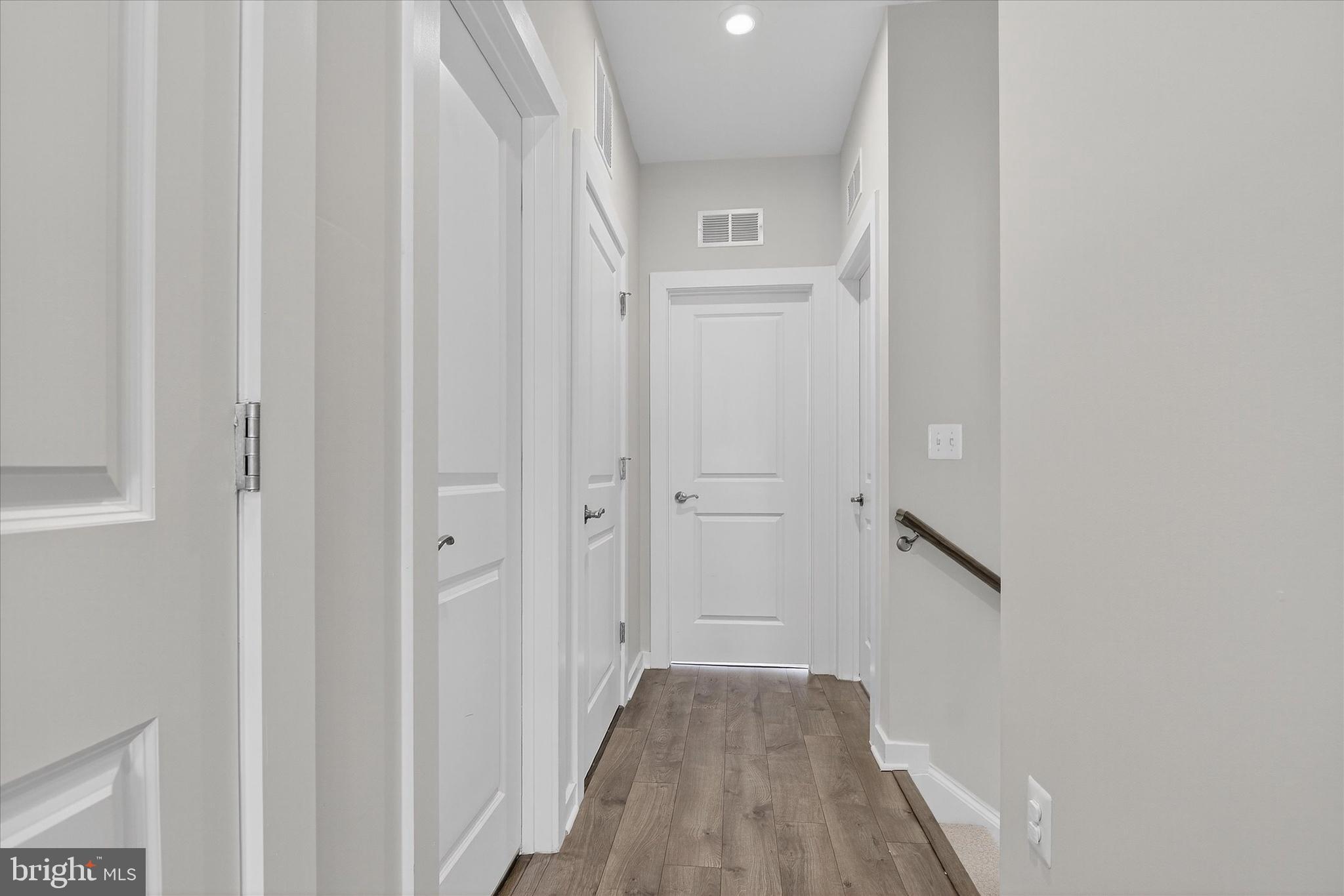 1681 Aspen Poplar Road Dumfries, VA 22026 - Photo 14 of 36 a view of a hallway with wooden floor and entryway
