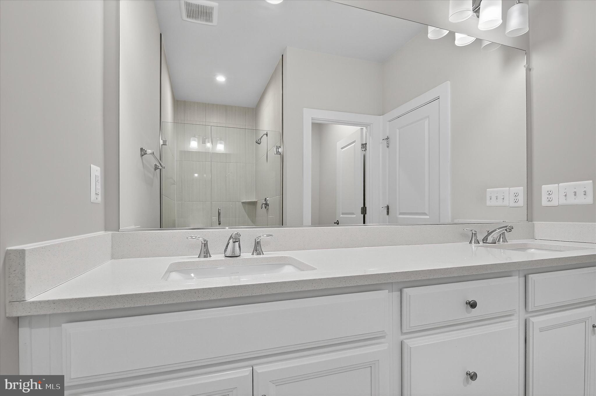 1681 Aspen Poplar Road Dumfries, VA 22026 - Photo 18 of 36 a bathroom with double sink and a mirror