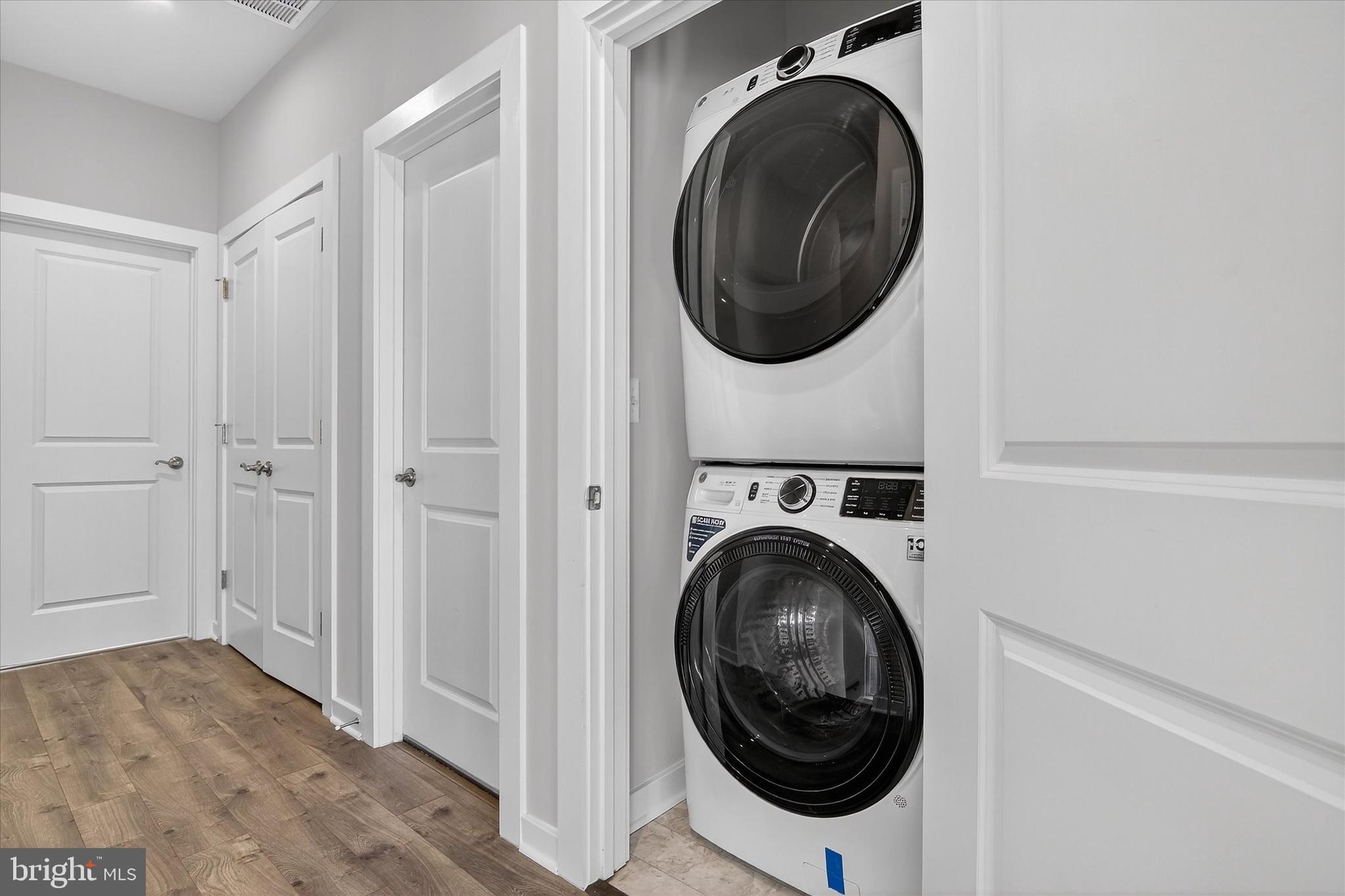 1681 Aspen Poplar Road Dumfries, VA 22026 - Photo 26 of 36 a view of a hallway with washer and dryer