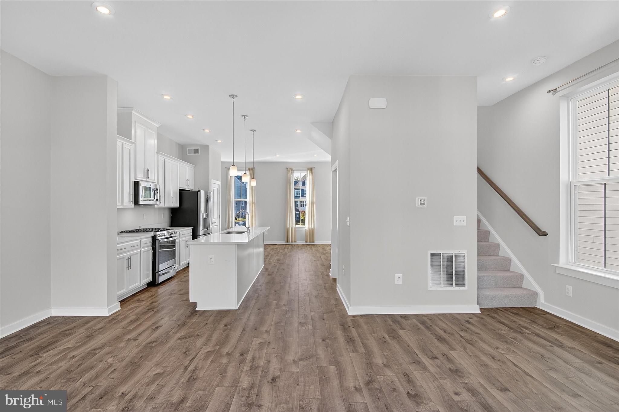 1681 Aspen Poplar Road Dumfries, VA 22026 - Photo 8 of 36 a view of kitchen with furniture and wooden floor