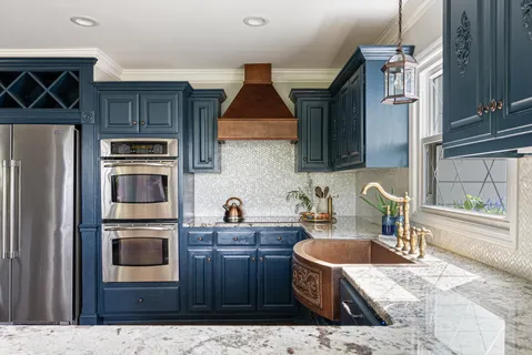 a kitchen with stainless steel appliances granite countertop a refrigerator stove and sink