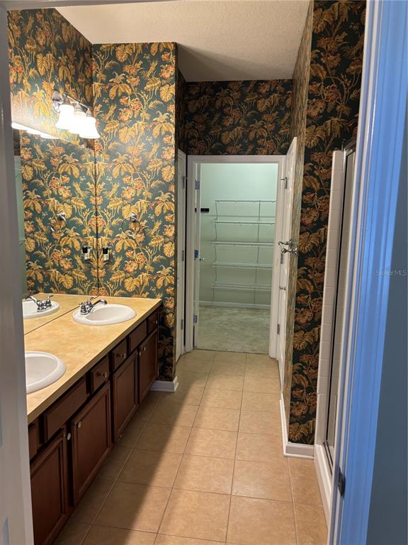 13719 Eastfork Lane Hudson, FL 34669 - Photo 9 of 17 a bathroom with a shower and a sink