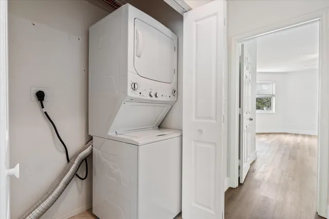 a view of hallway with wooden floor
