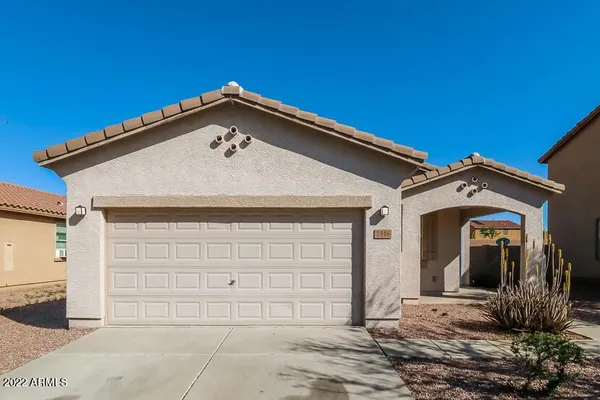 a front view of a house with garage