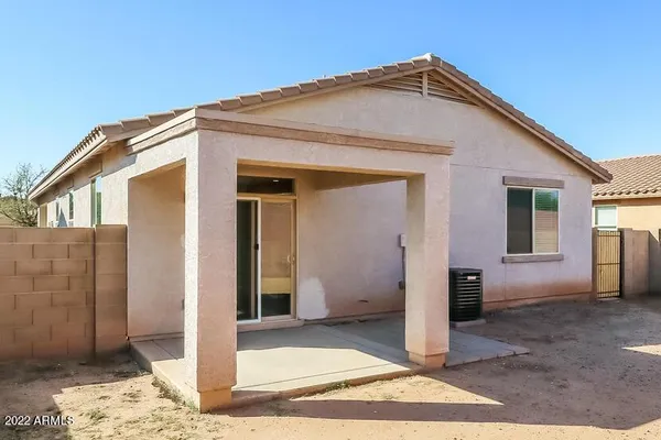 a view of a house with a backyard