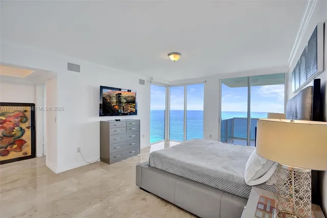 a bathroom with a granite countertop tub sink and mirror