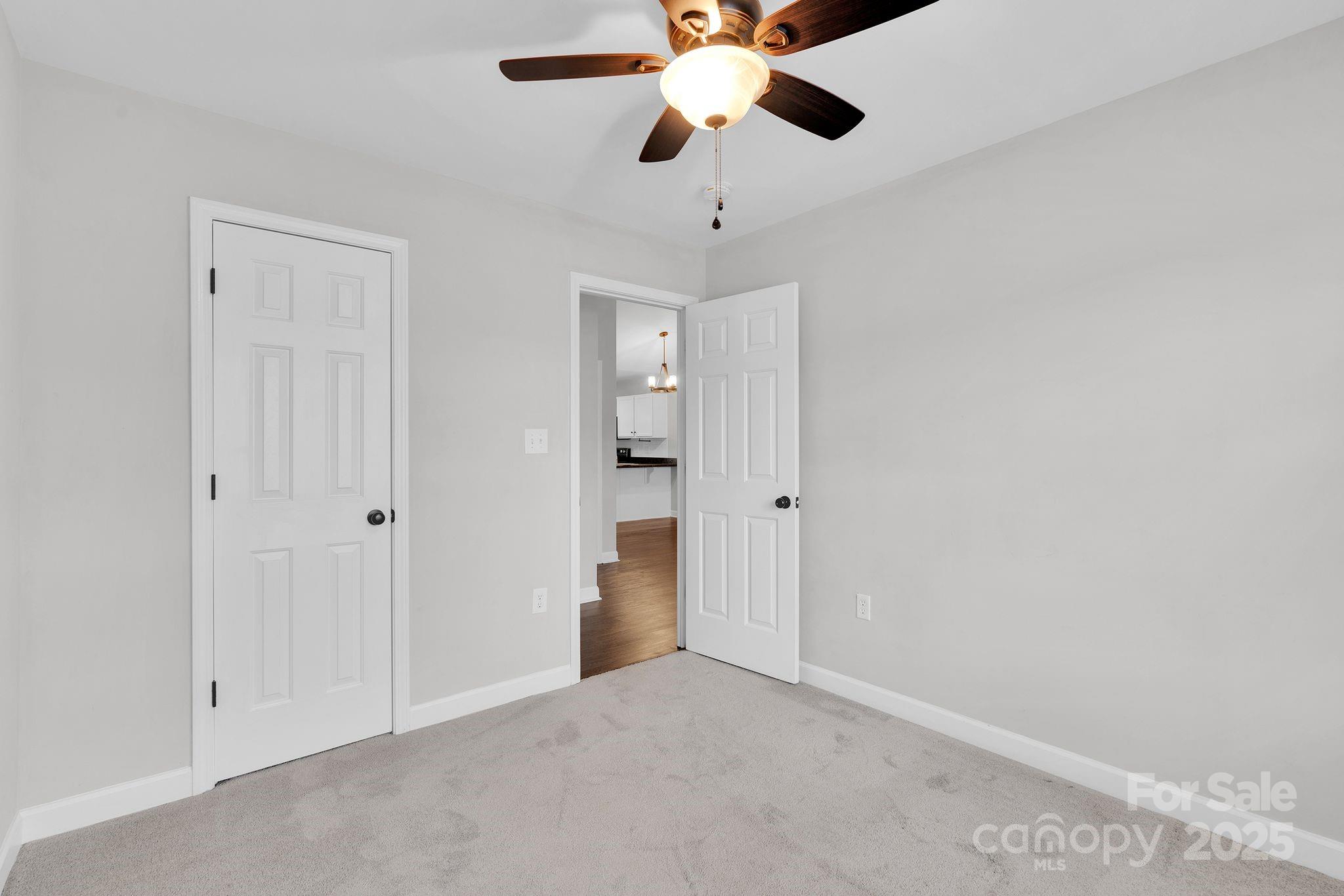 743 Waterfall Way Clover, SC 29710 - Photo 13 of 20 a view of an empty room and chandelier fan