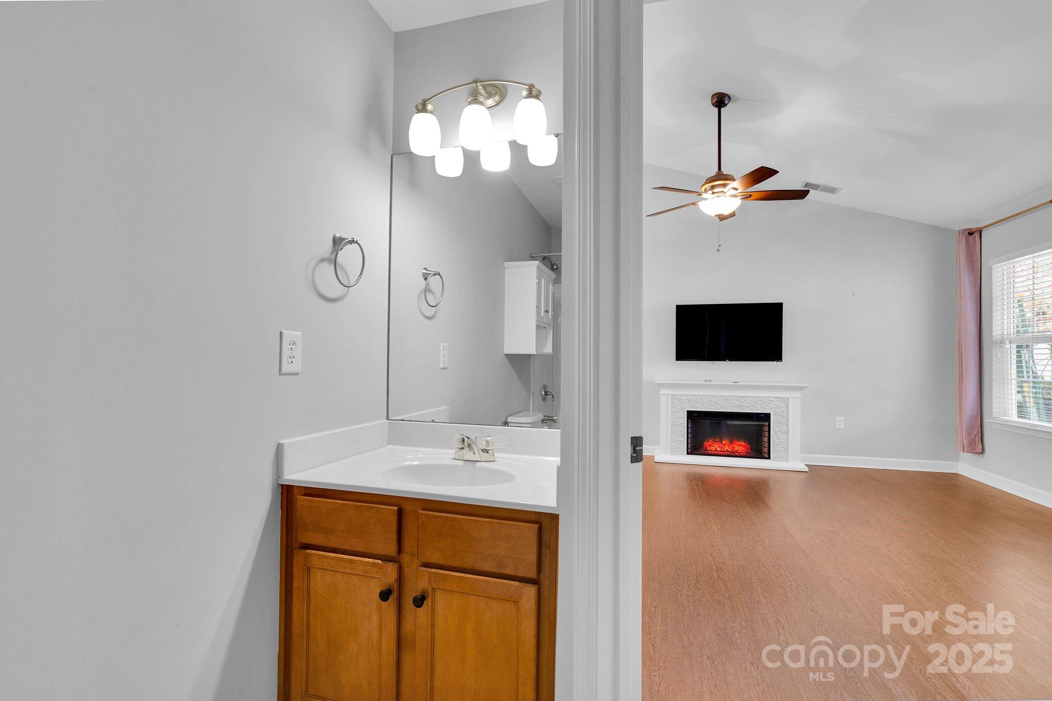 743 Waterfall Way Clover, SC 29710 - Photo 15 of 20 a spacious bathroom with a sink and a mirror