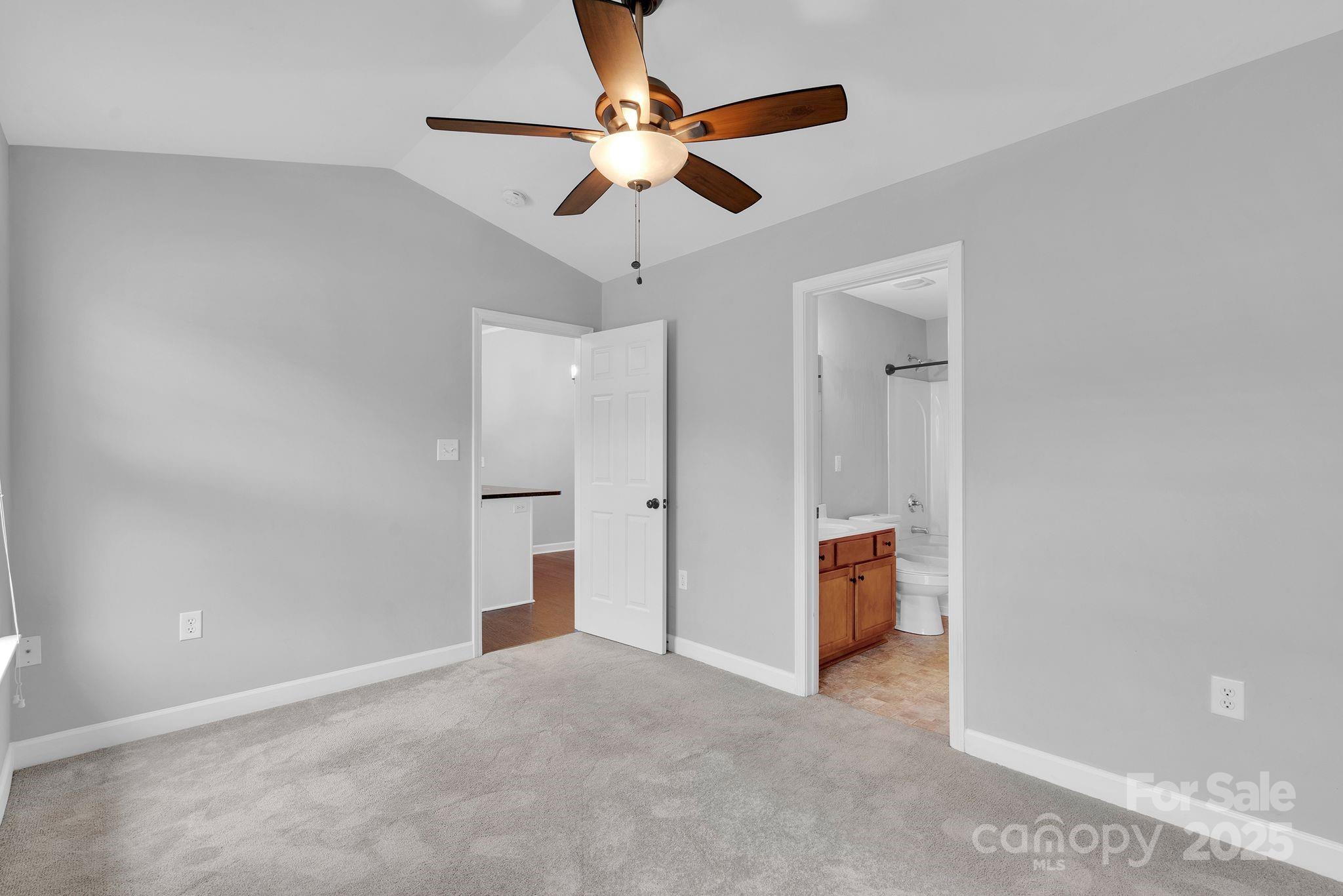 743 Waterfall Way Clover, SC 29710 - Photo 8 of 20 an empty room and chandelier fan in hallway