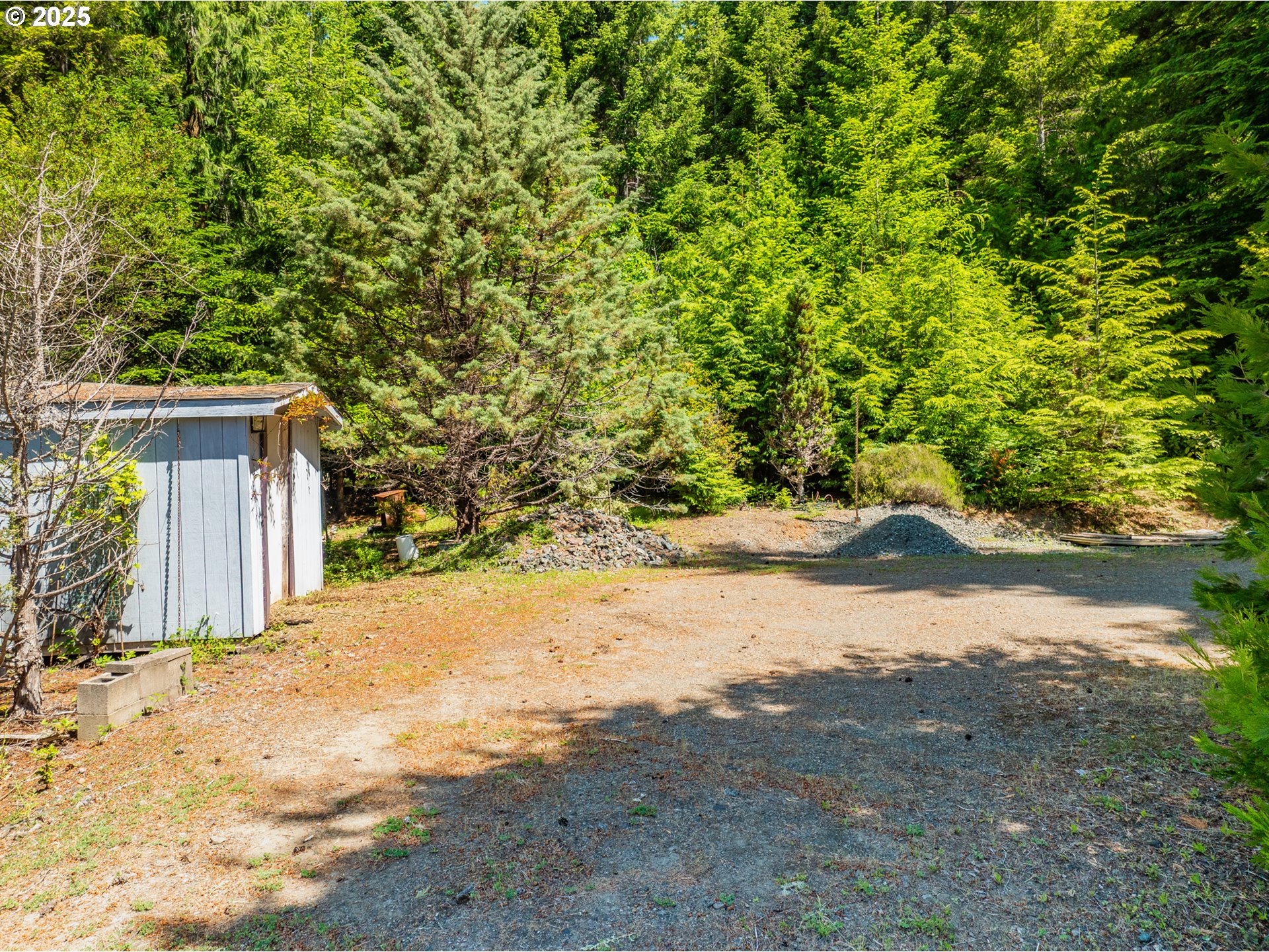 58812 Garden Valley Road Coquille, OR 97423 - Photo 4 of 36 a view of a yard with a house