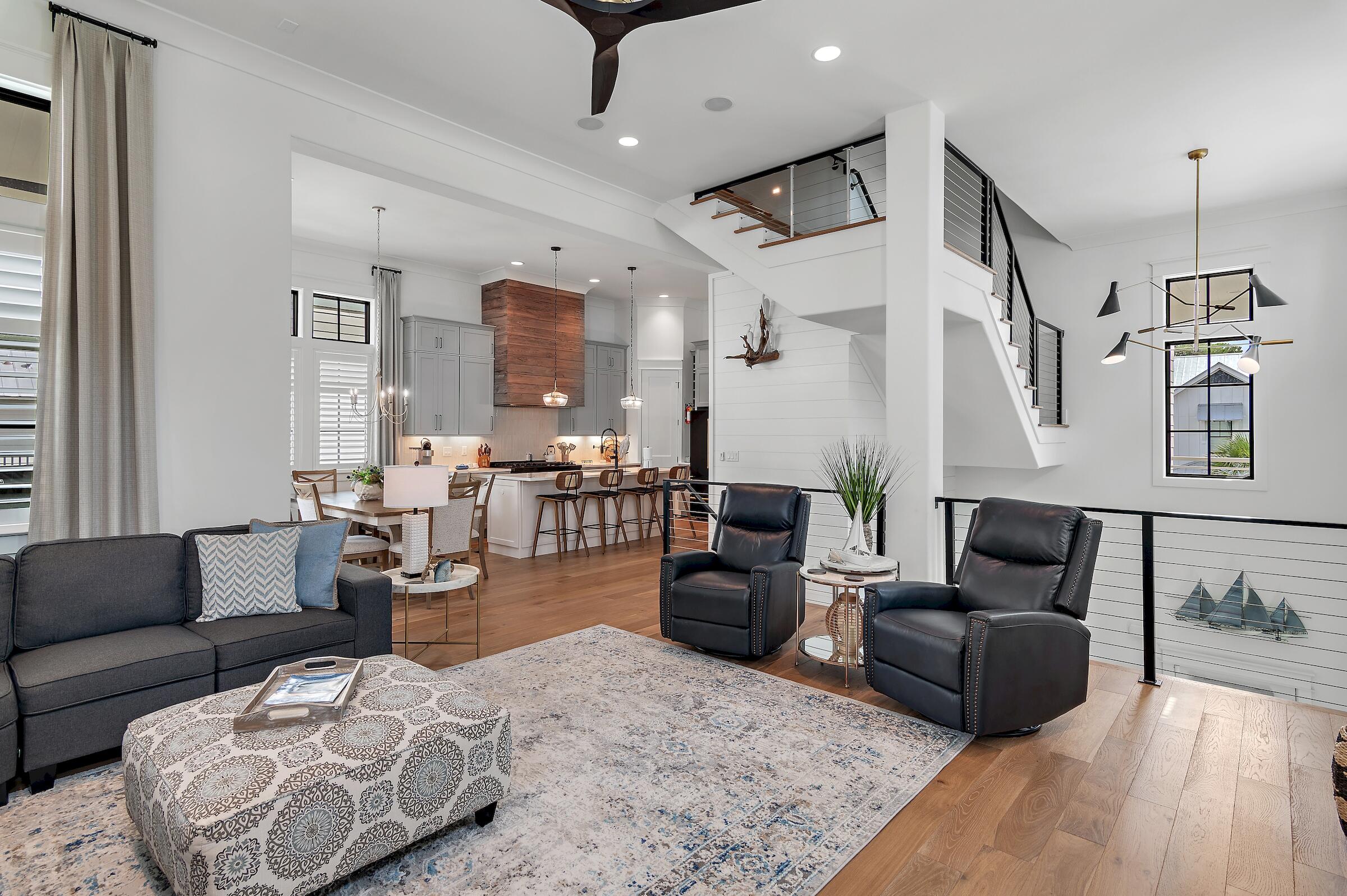 71 Grande Pointe Drive Inlet Beach, FL 32461 - Photo 20 of 48 a living room with furniture or couch and a chandelier