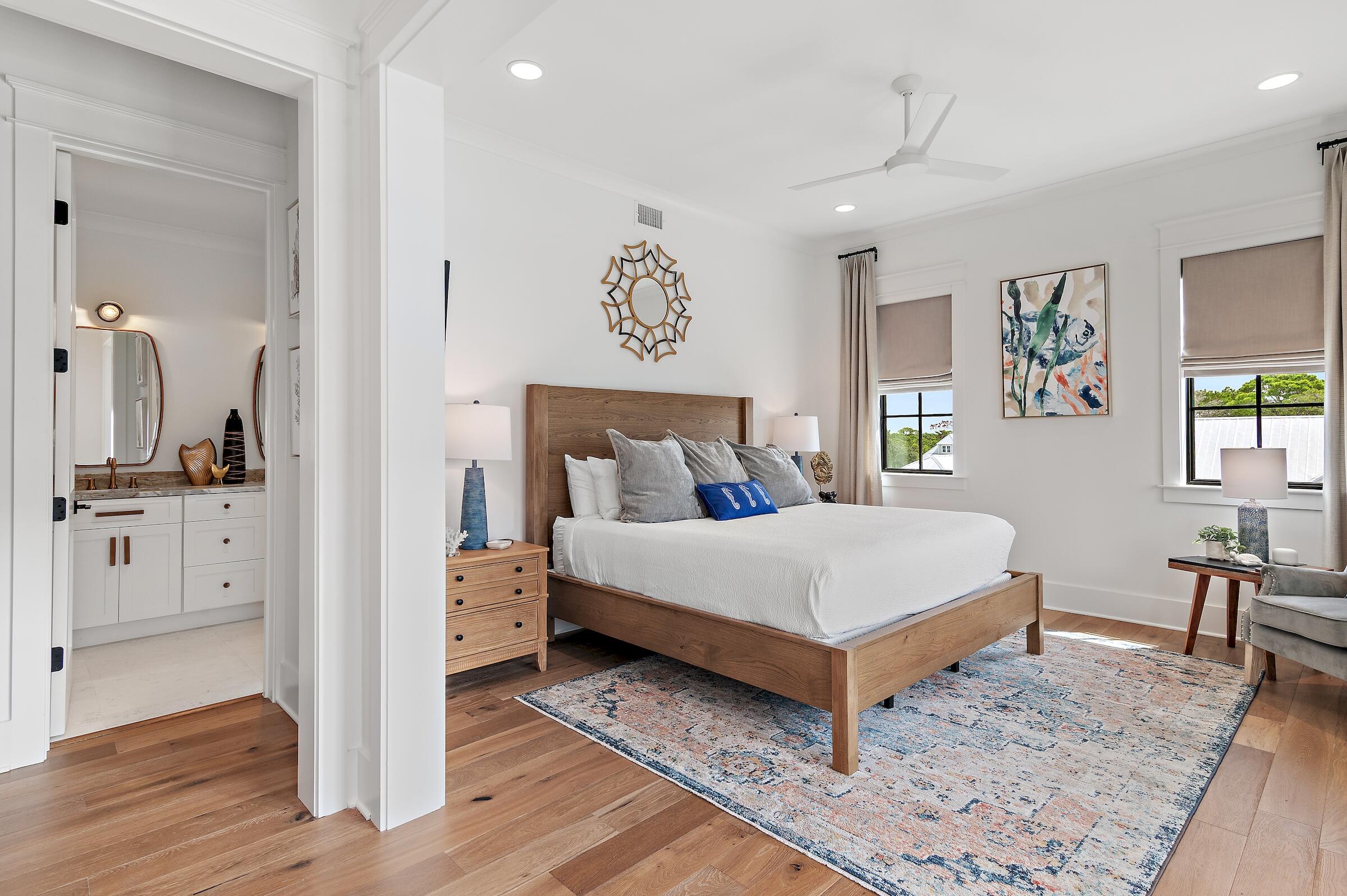 71 Grande Pointe Drive Inlet Beach, FL 32461 - Photo 33 of 48 a bedroom with a bed and a table in it