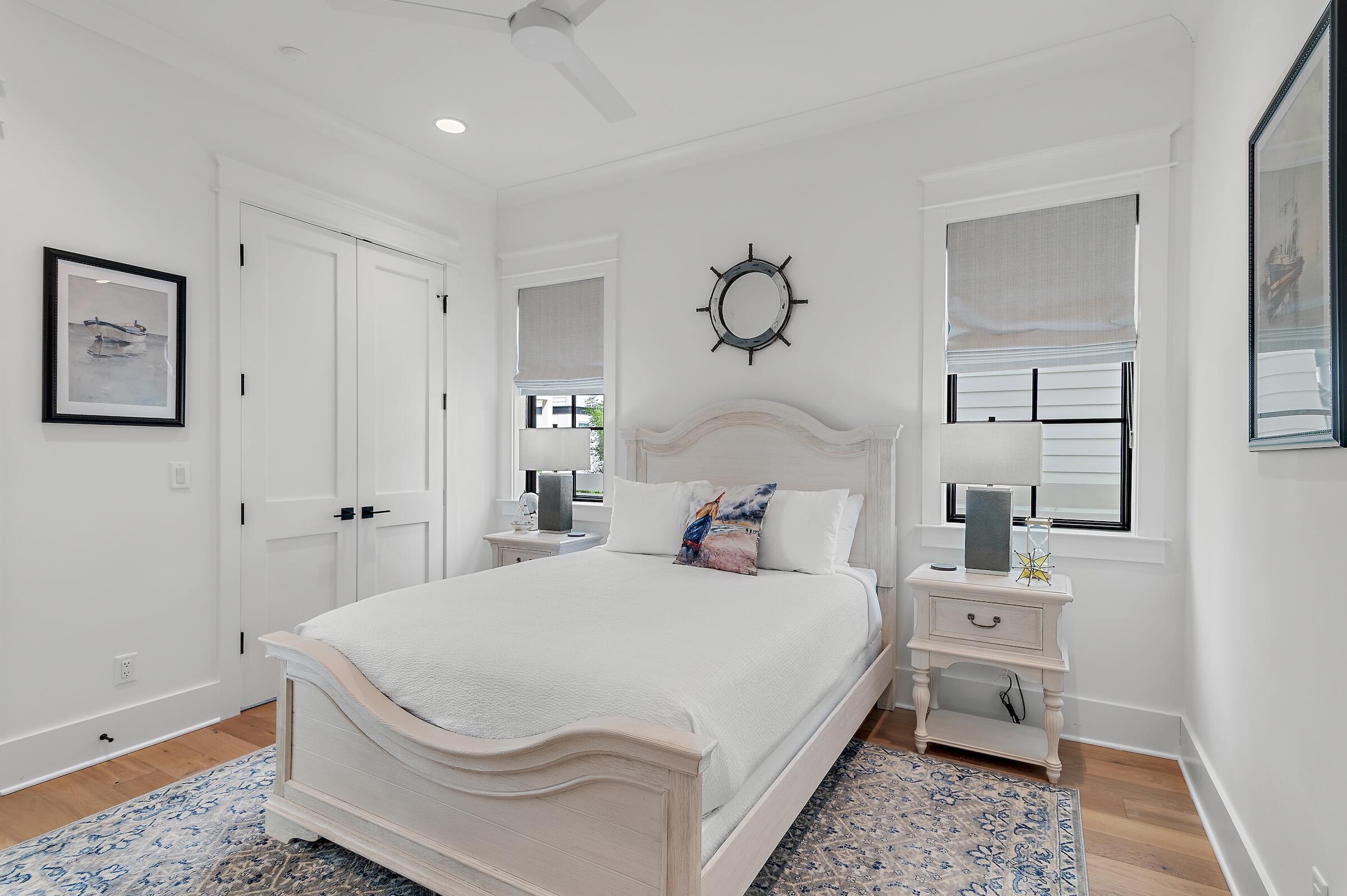 71 Grande Pointe Drive Inlet Beach, FL 32461 - Photo 42 of 48 a bedroom with a bed and a chandelier