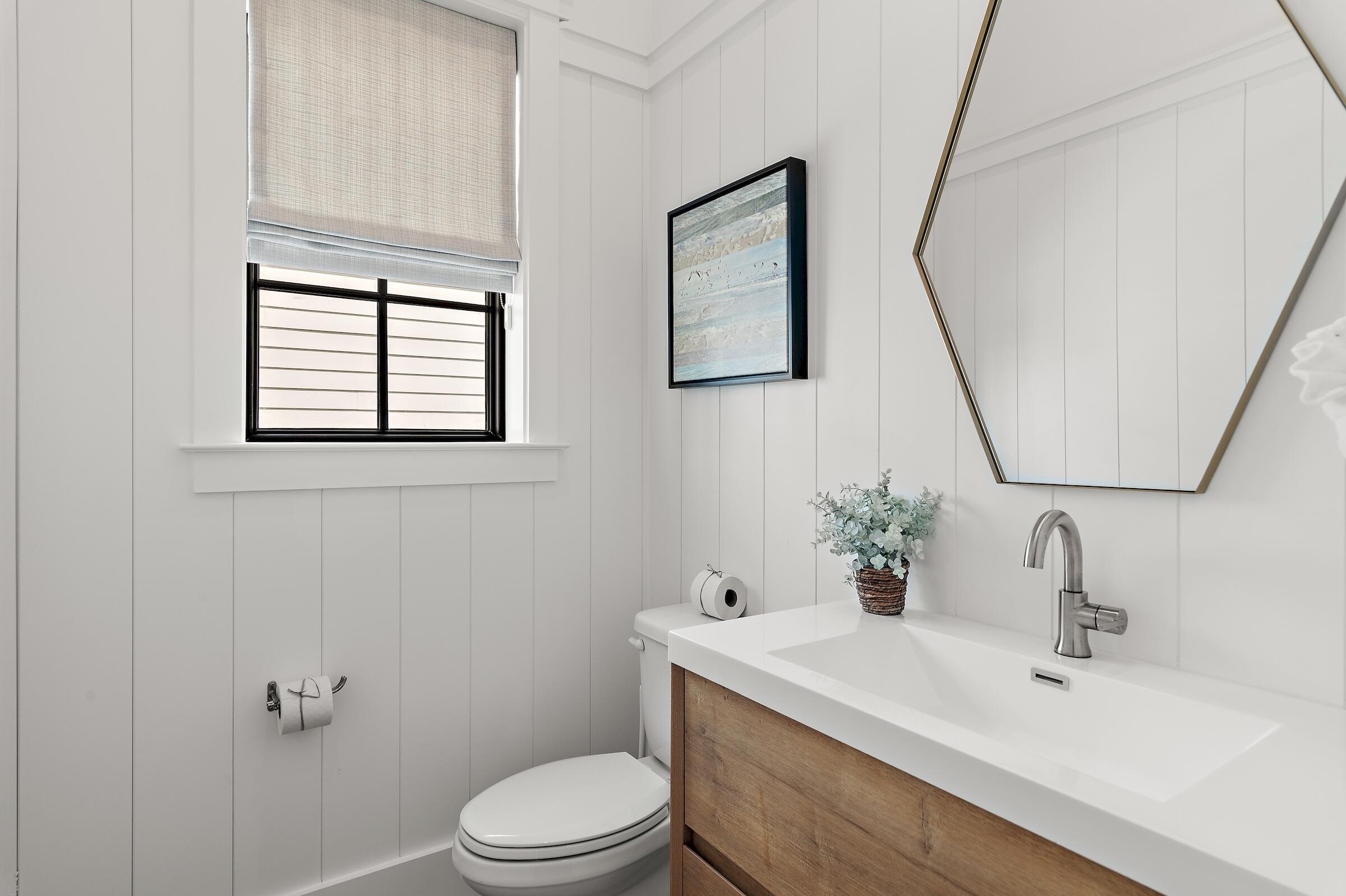 71 Grande Pointe Drive Inlet Beach, FL 32461 - Photo 44 of 48 a bathroom with a sink vanity mirror and toilet