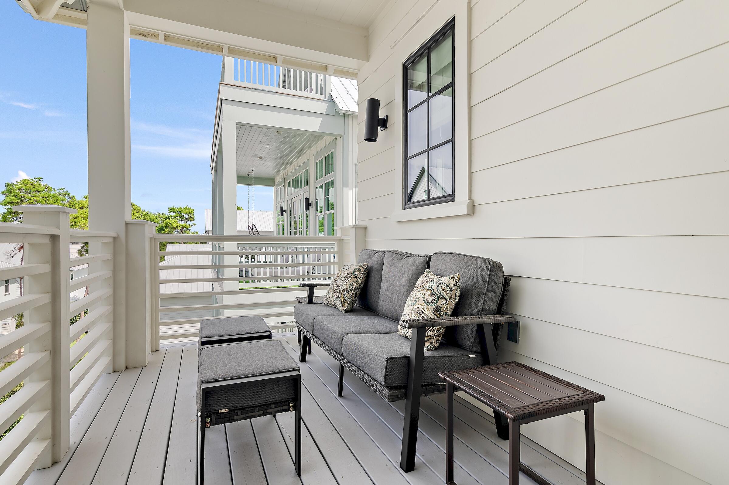 71 Grande Pointe Drive Inlet Beach, FL 32461 - Photo 47 of 48 a living room with furniture a wooden floor and next to a window