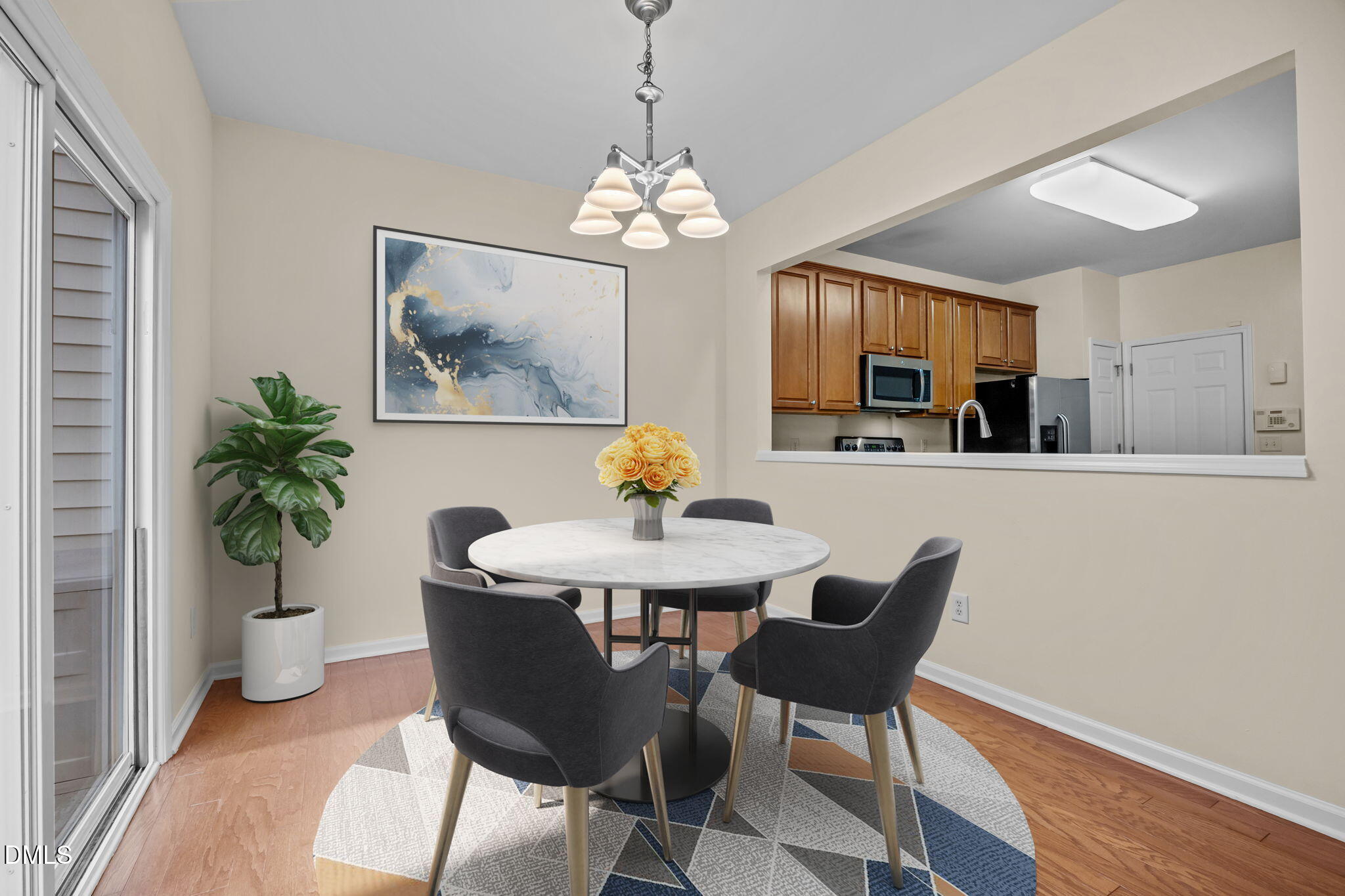 7805 Jeffrey Alan Court Raleigh, NC 27613 - Photo 11 of 46 a view of a dining room with furniture and chandelier