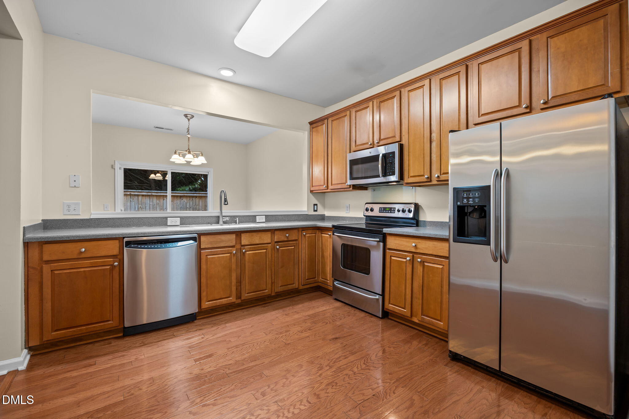 7805 Jeffrey Alan Court Raleigh, NC 27613 - Photo 15 of 46 a kitchen with granite countertop stainless steel appliances and cabinets
