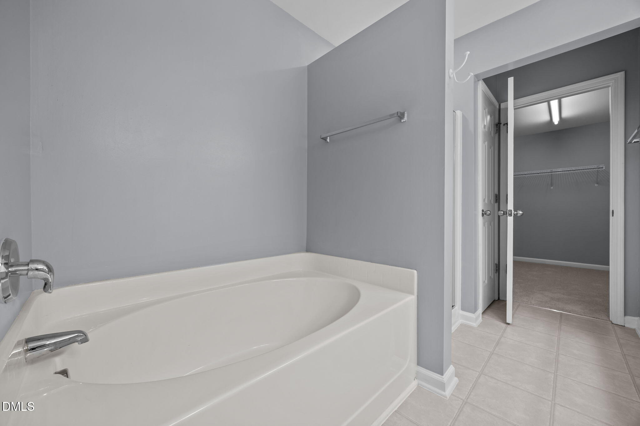 7805 Jeffrey Alan Court Raleigh, NC 27613 - Photo 24 of 46 a white bath tub sitting in a bathroom