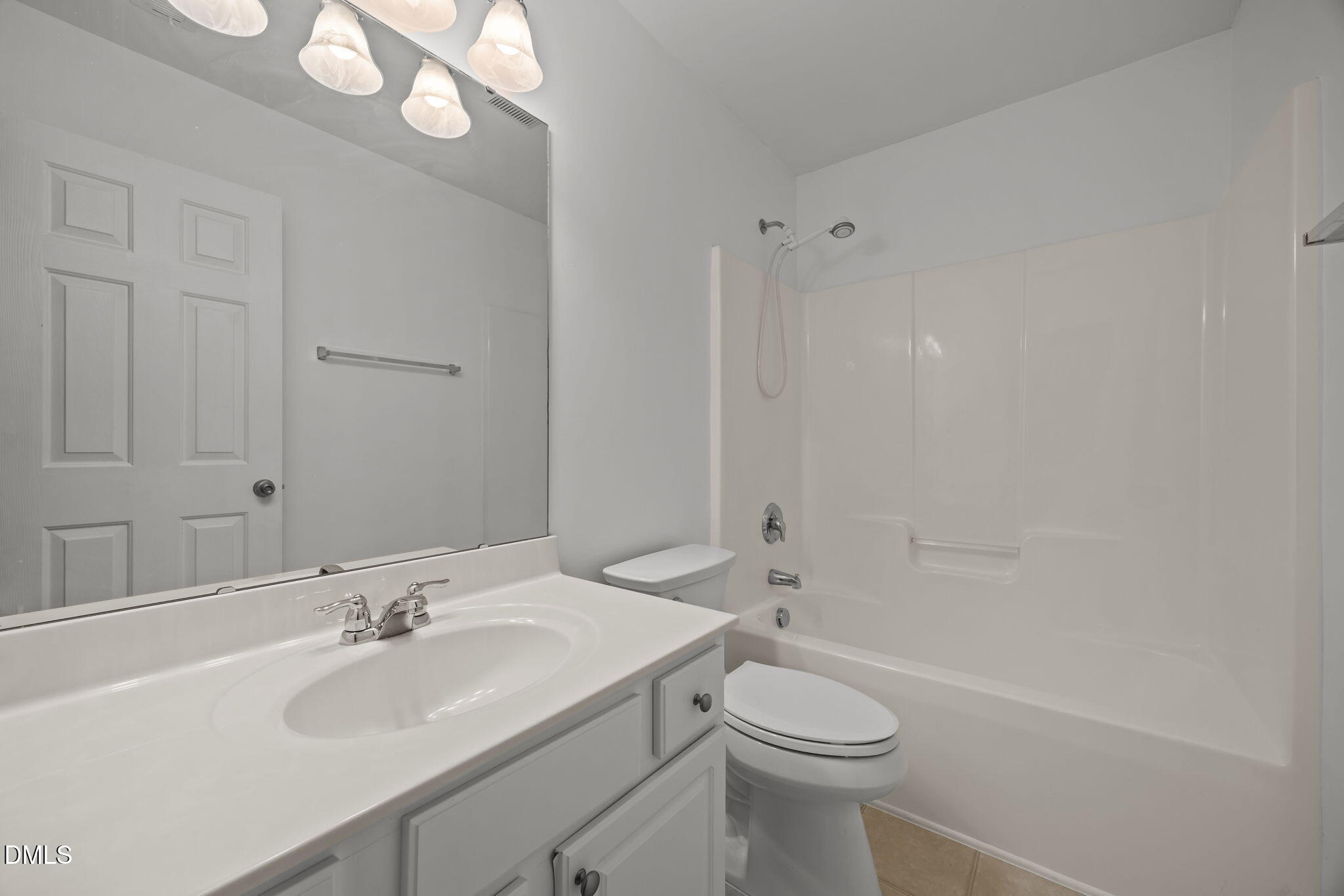 7805 Jeffrey Alan Court Raleigh, NC 27613 - Photo 29 of 46 a bathroom with a sink toilet and shower