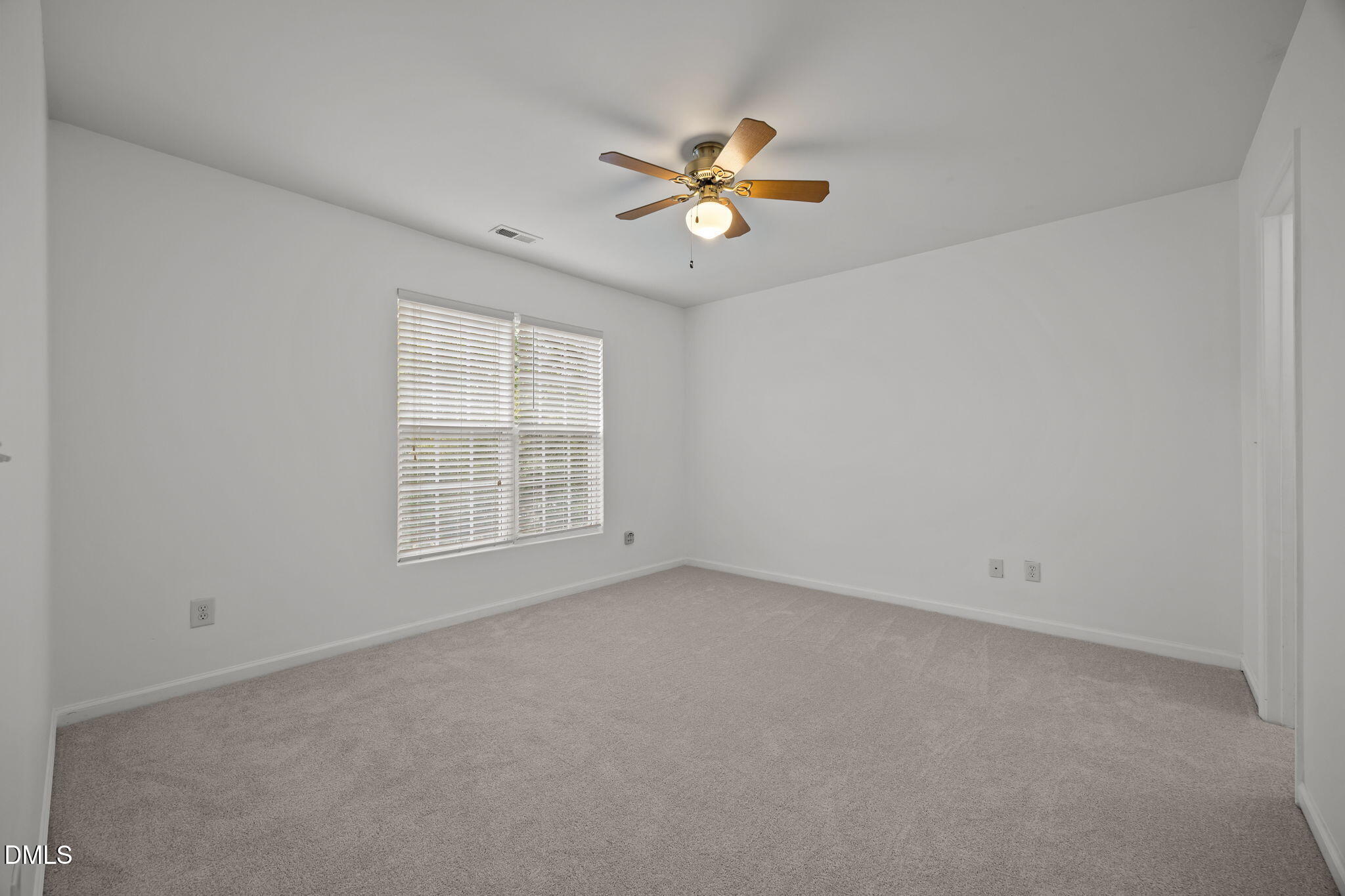 7805 Jeffrey Alan Court Raleigh, NC 27613 - Photo 30 of 46 a view of an empty room with a window