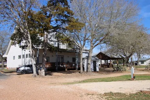a view of a yard with swings