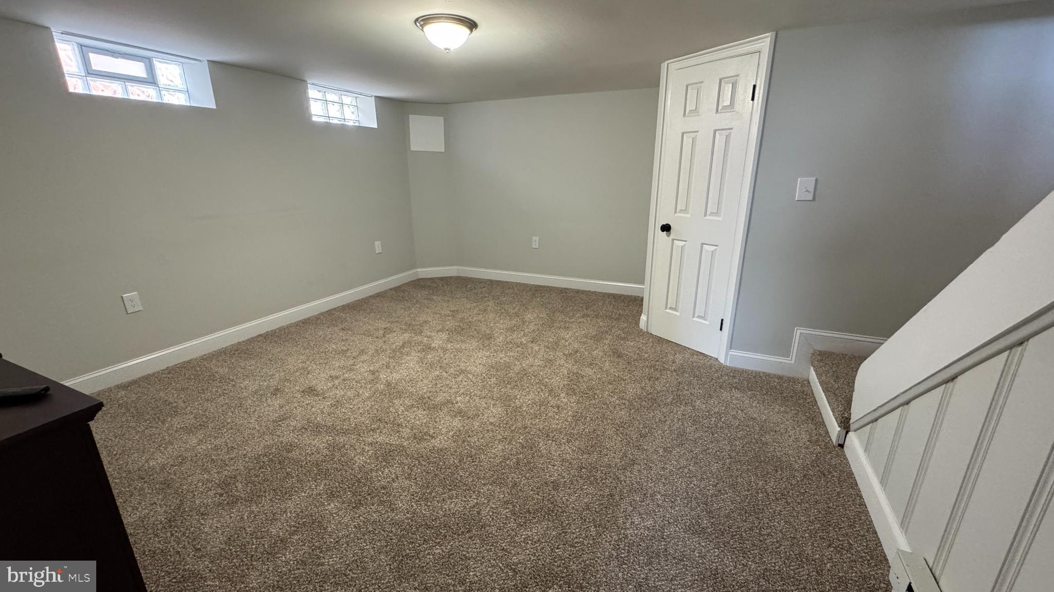 8029 Stratman Road Dundalk, MD 21222 - Photo 12 of 41 en empty room with windows
