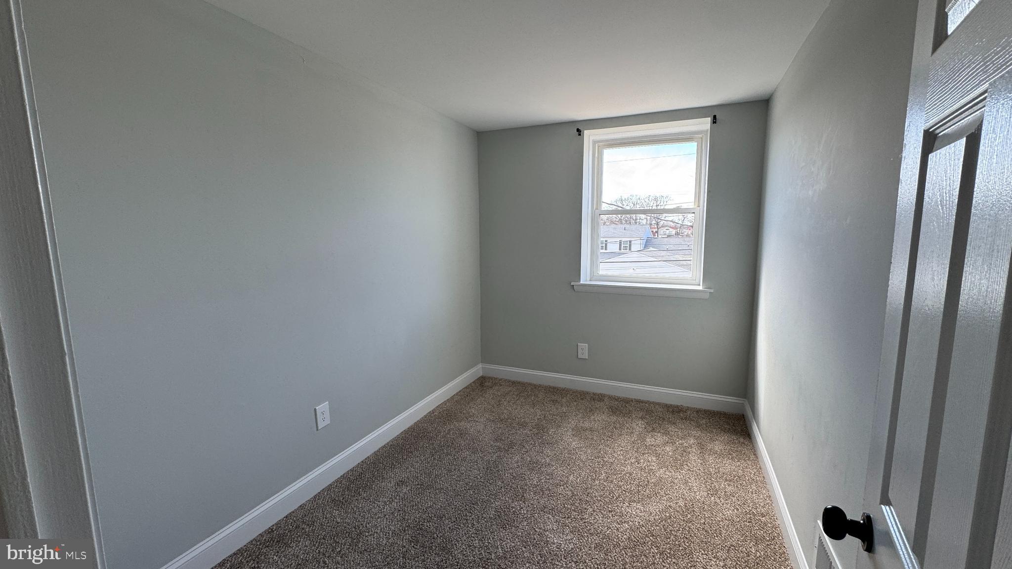 8029 Stratman Road Dundalk, MD 21222 - Photo 15 of 41 an empty room with windows