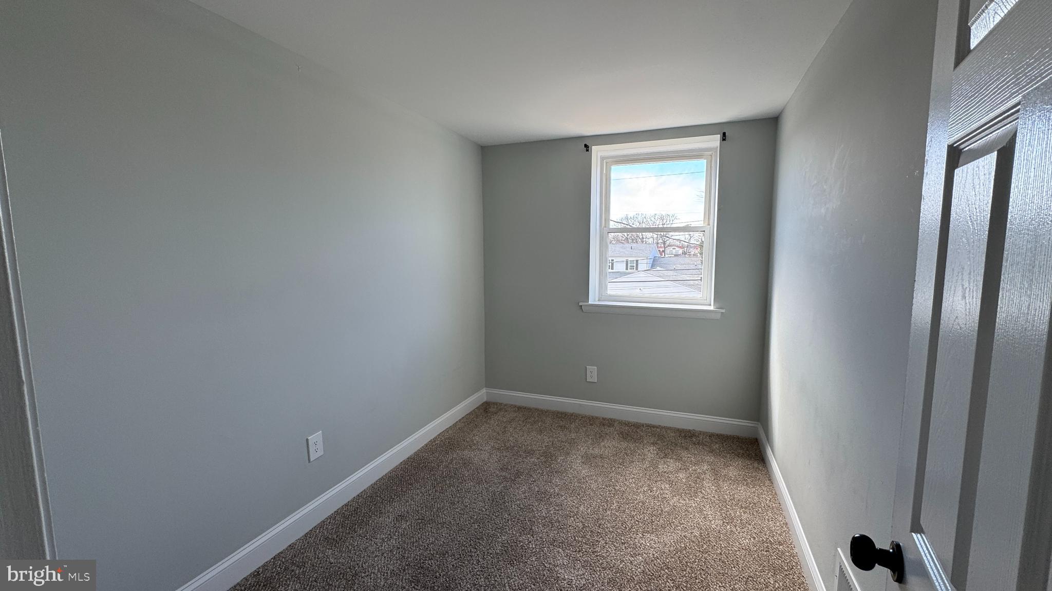 8029 Stratman Road Dundalk, MD 21222 - Photo 26 of 41 a view of an empty room with window and bathroom